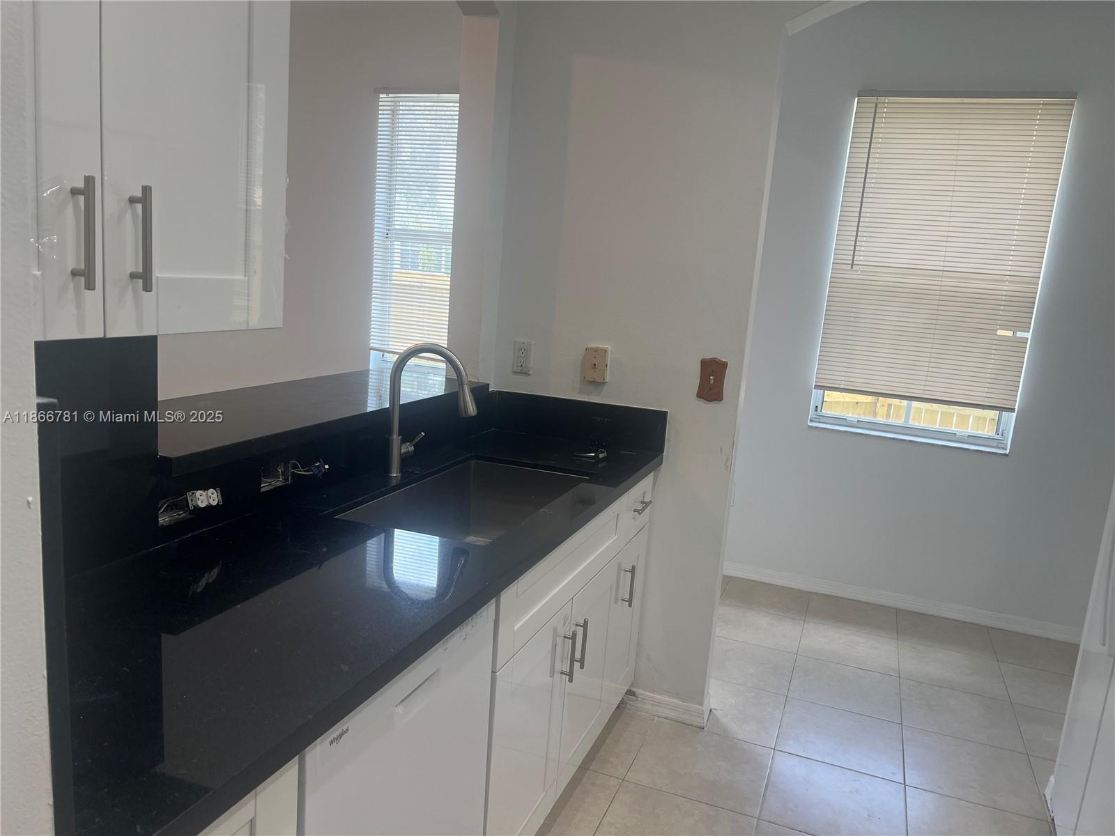 4287 Northeast 9th Street Homestead, FL 33033 - Photo 12 of 25 a kitchen with a sink and cabinets