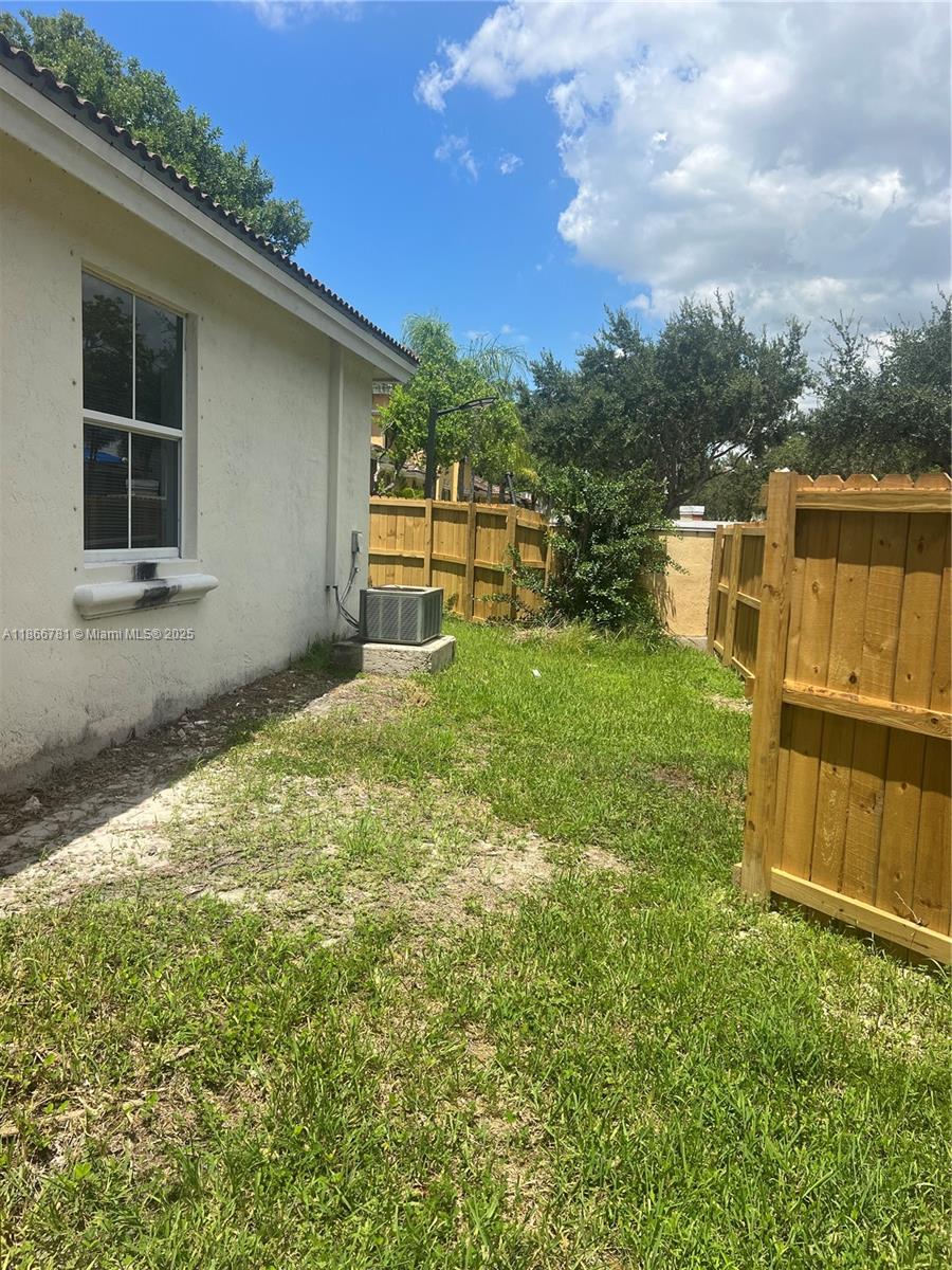 4287 Northeast 9th Street Homestead, FL 33033 - Photo 20 of 25 a view of a backyard with large trees