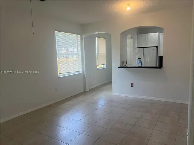 a view of room with window and cabinet