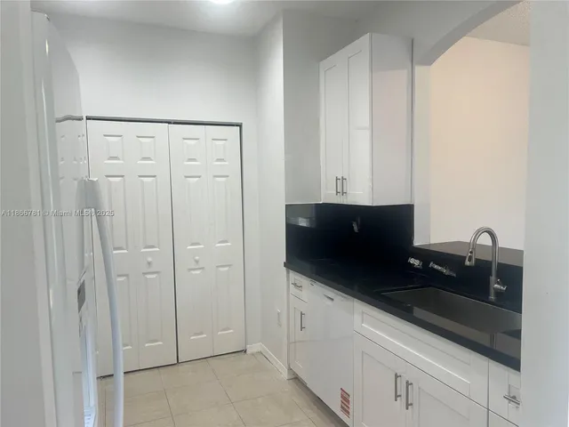 a utility room with washer and dryer