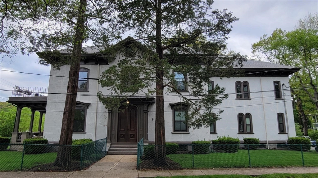 73 Elm Road, Unit 8 Newton, MA 02460 - Photo 12 of 12 a front view of a house with garden