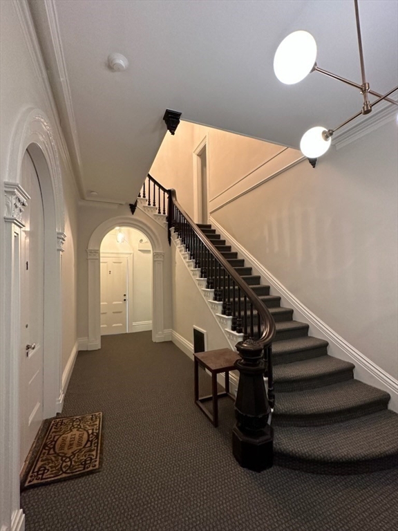 73 Elm Road, Unit 8 Newton, MA 02460 - Photo 3 of 12 a view of entryway and hall with wooden floor