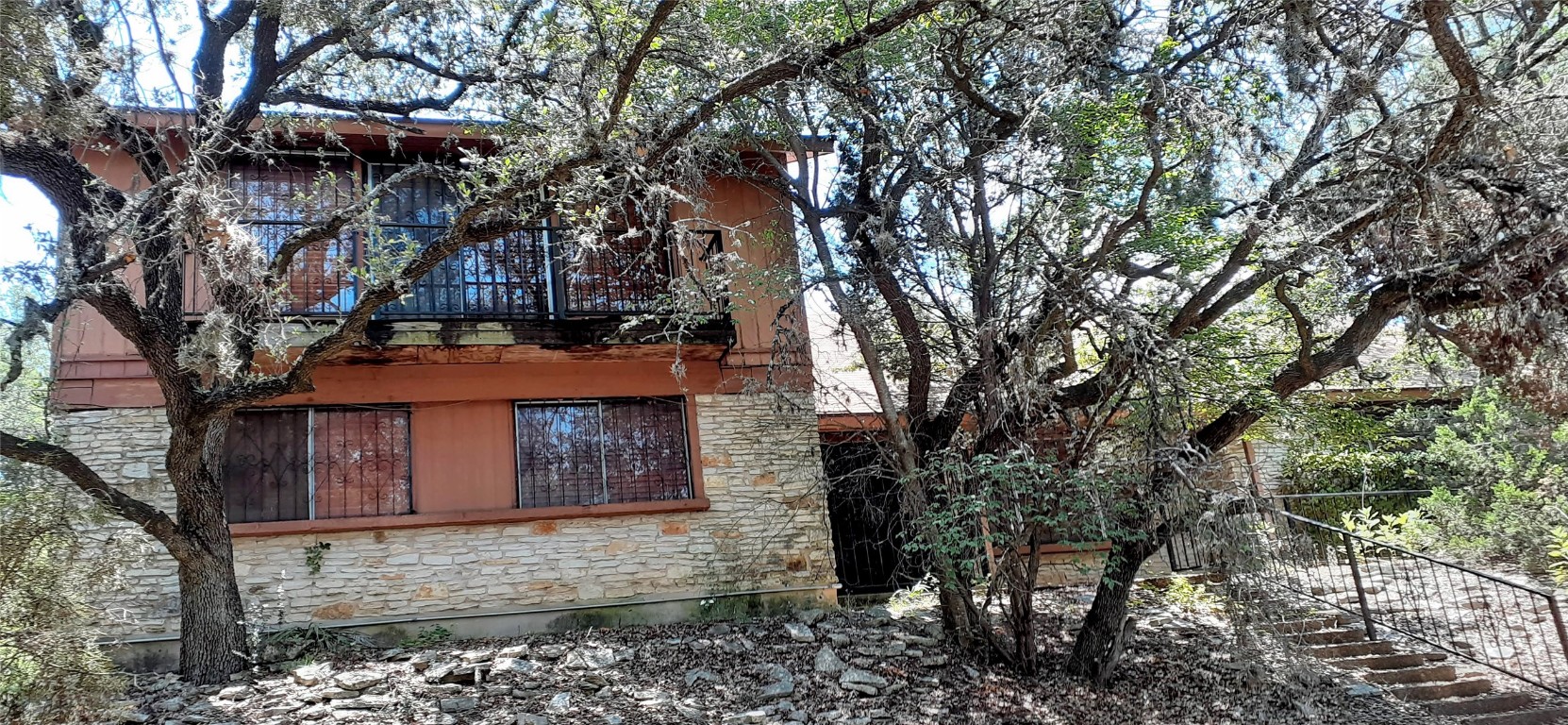 a view of a house with a tree