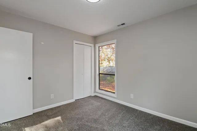 a view of an empty room and window