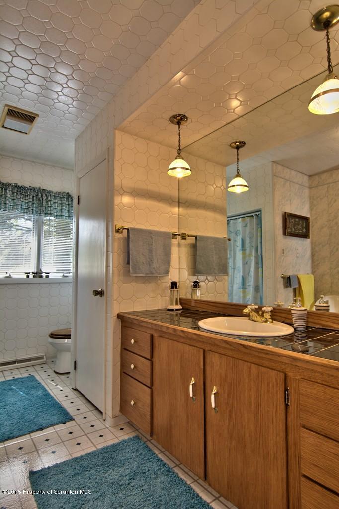 2335 Hamlin Road Moscow, PA 18444 - Photo 20 of 34 a bathroom with a sink and a mirror