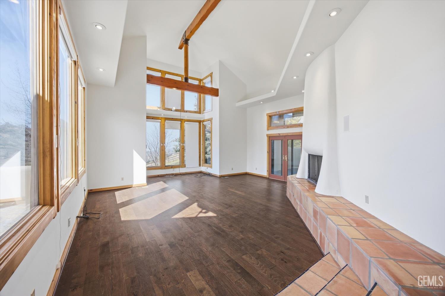 Undisclosed Address Tehachapi, CA 93561 - Photo 11 of 70 wooden floor in an empty room with a window and wooden floor