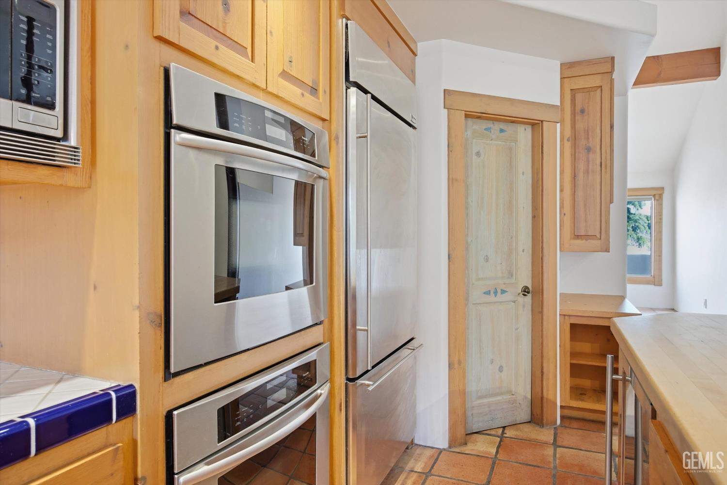 Undisclosed Address Tehachapi, CA 93561 - Photo 26 of 70 a view of a kitchen from the hallway
