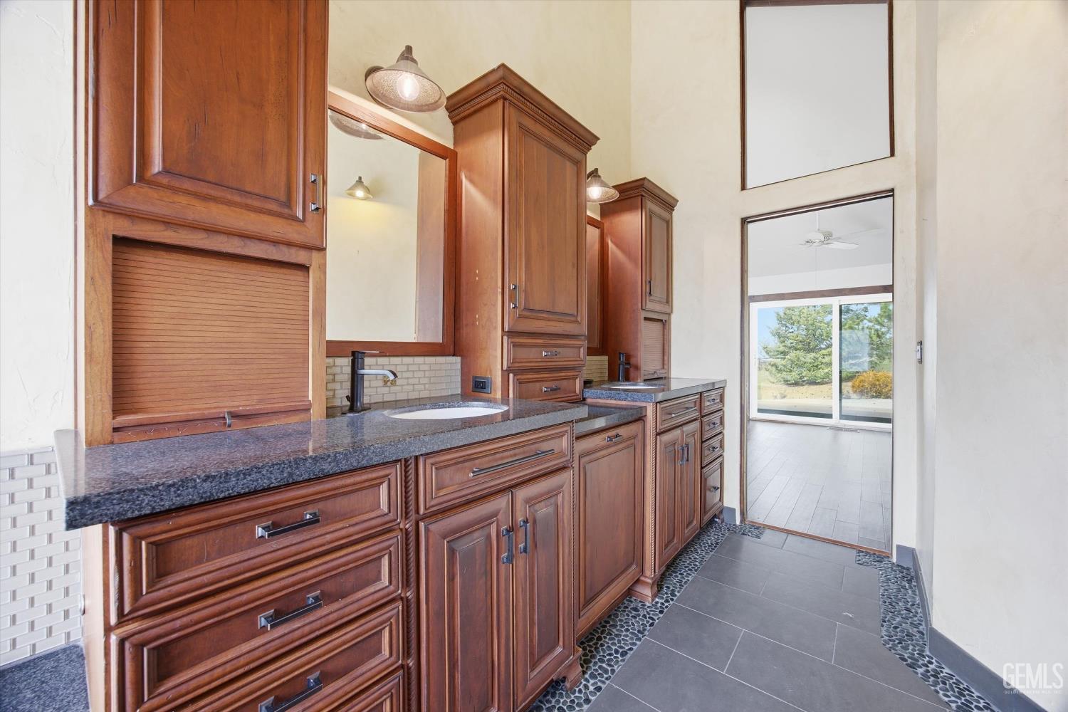Undisclosed Address Tehachapi, CA 93561 - Photo 34 of 70 a kitchen with stainless steel appliances granite countertop a sink and a refrigerator
