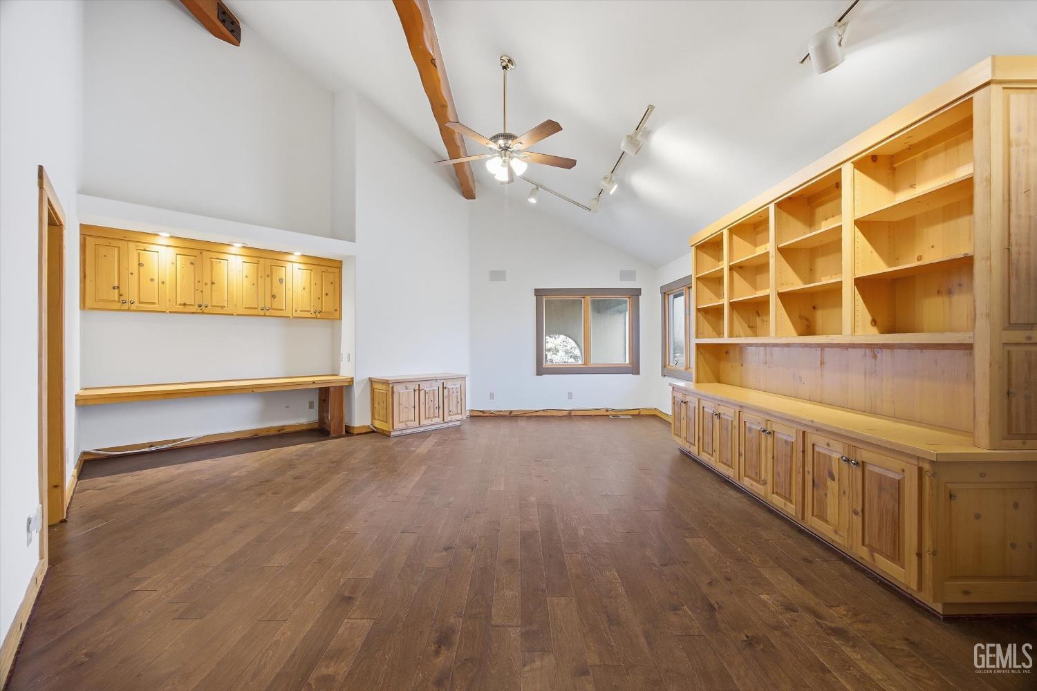 Undisclosed Address Tehachapi, CA 93561 - Photo 35 of 70 a view of an empty room with a window and wooden floor