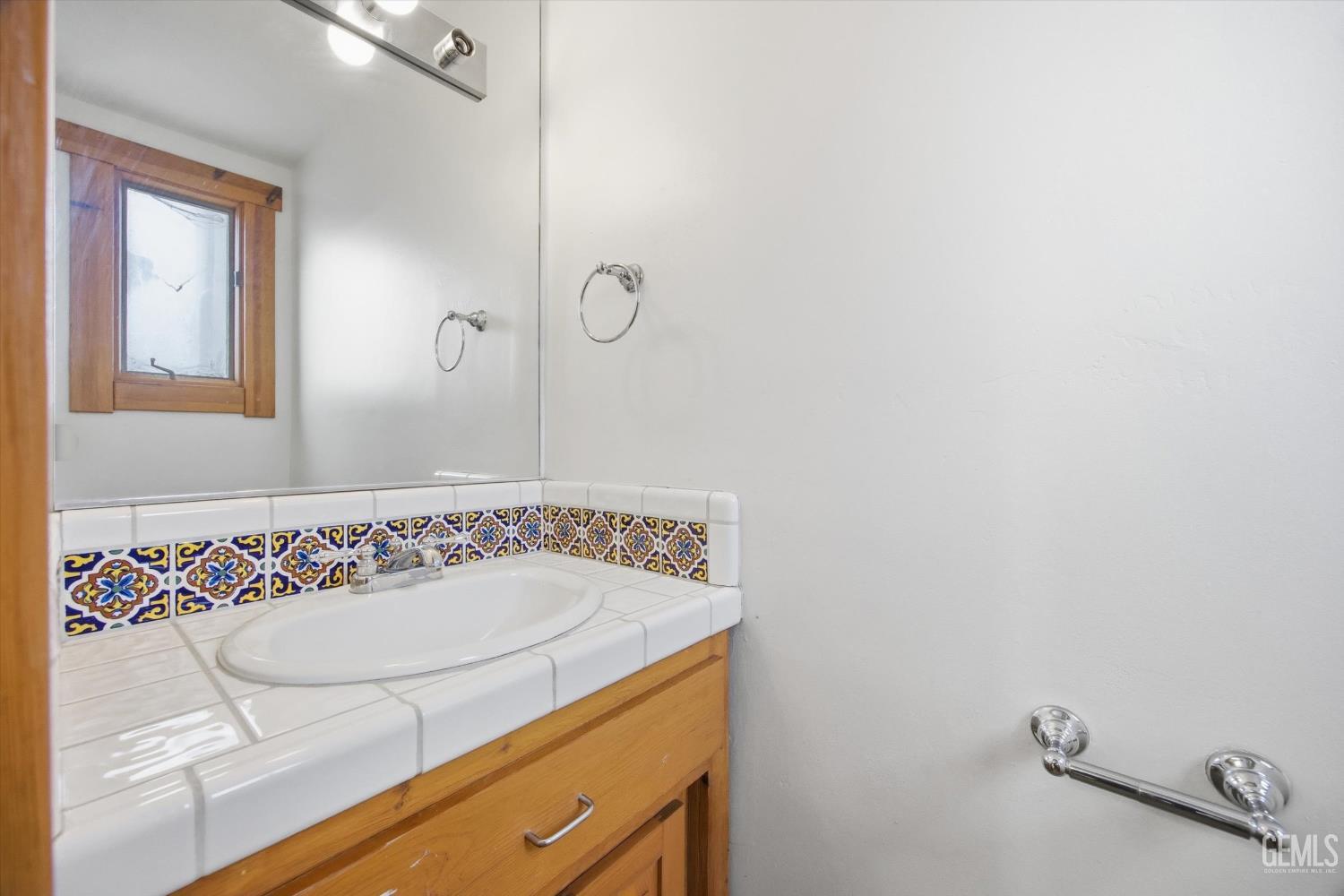 Undisclosed Address Tehachapi, CA 93561 - Photo 42 of 70 a bathroom with a sink and a mirror