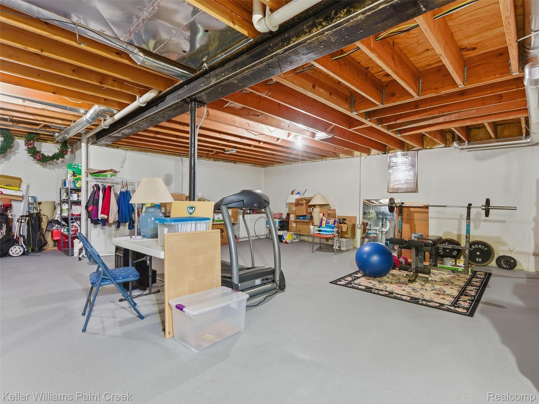 2842 Manorwood Road Troy, MI 48085 - Photo 59 of 72 Unfinished basement offering expansive open space with exposed wood joists and structural beams