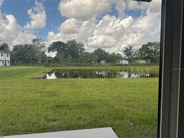 a view of a lake with a big yard
