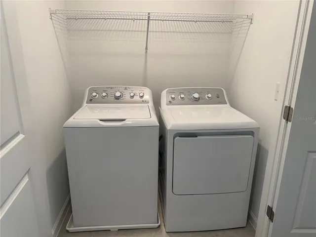 a utility room with dryer and washer