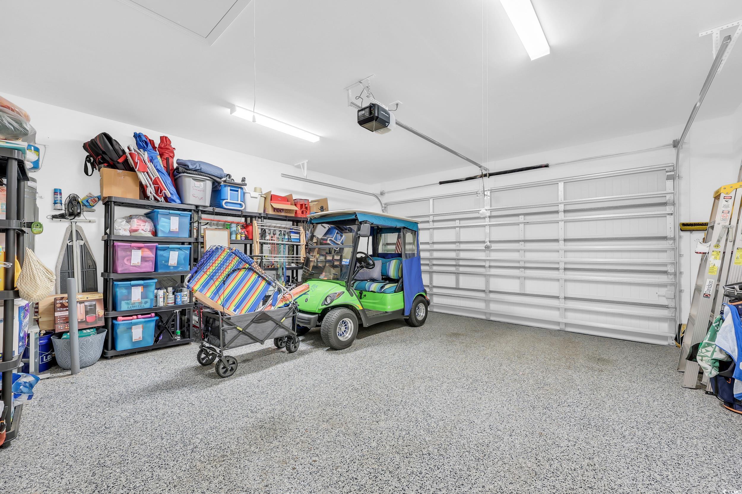 147 Machrie Loop, Unit D Myrtle Beach, SC 29588 - Photo 23 of 36 Garage with a garage door opener