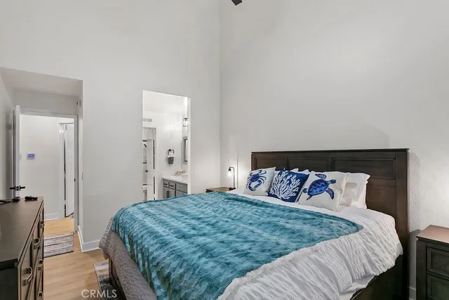 a bedroom with a bed and a mirror
