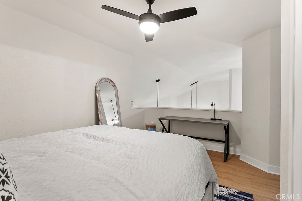 8 Coral Ridge, Unit 109 Laguna Niguel, CA 92677 - Photo 17 of 29 a bedroom with a bed and a dresser