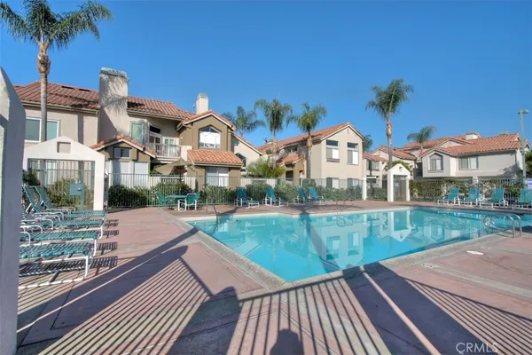 a view of a swimming pool with a patio
