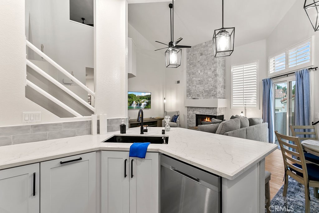 8 Coral Ridge, Unit 109 Laguna Niguel, CA 92677 - Photo 9 of 29 a view of dining table and chandelier