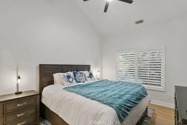 a bedroom with a bed and a night stand