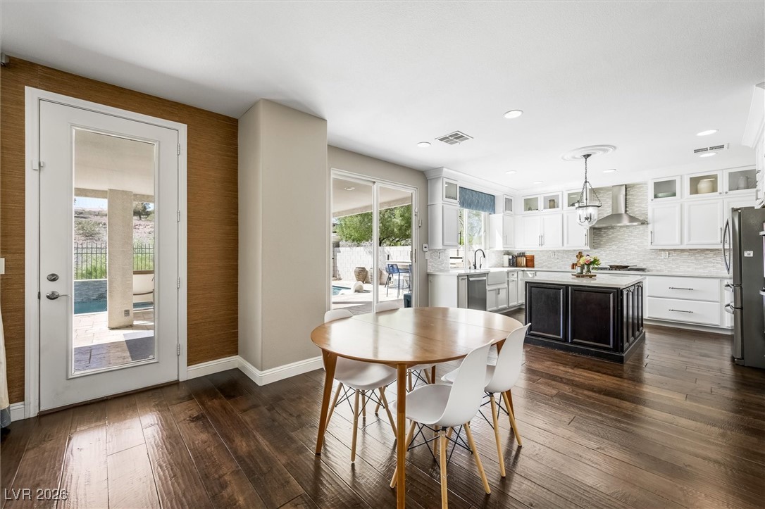 1673 Ravanusa Drive Henderson, NV 89052 - Photo 15 of 66 Dining space featuring dark wood-style flooring and recessed lighting