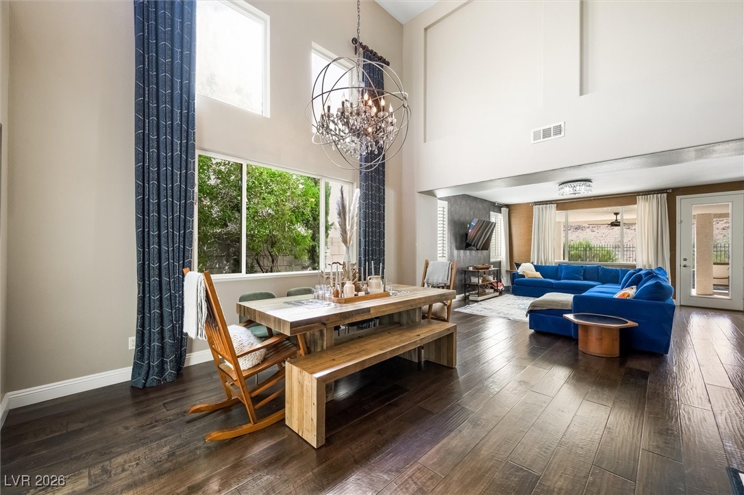 1673 Ravanusa Drive Henderson, NV 89052 - Photo 4 of 66 The gorgeous dining area is open to the living room, with the pre-exisitng wall seperating the two having been removed for an open feeling and seamless flow.