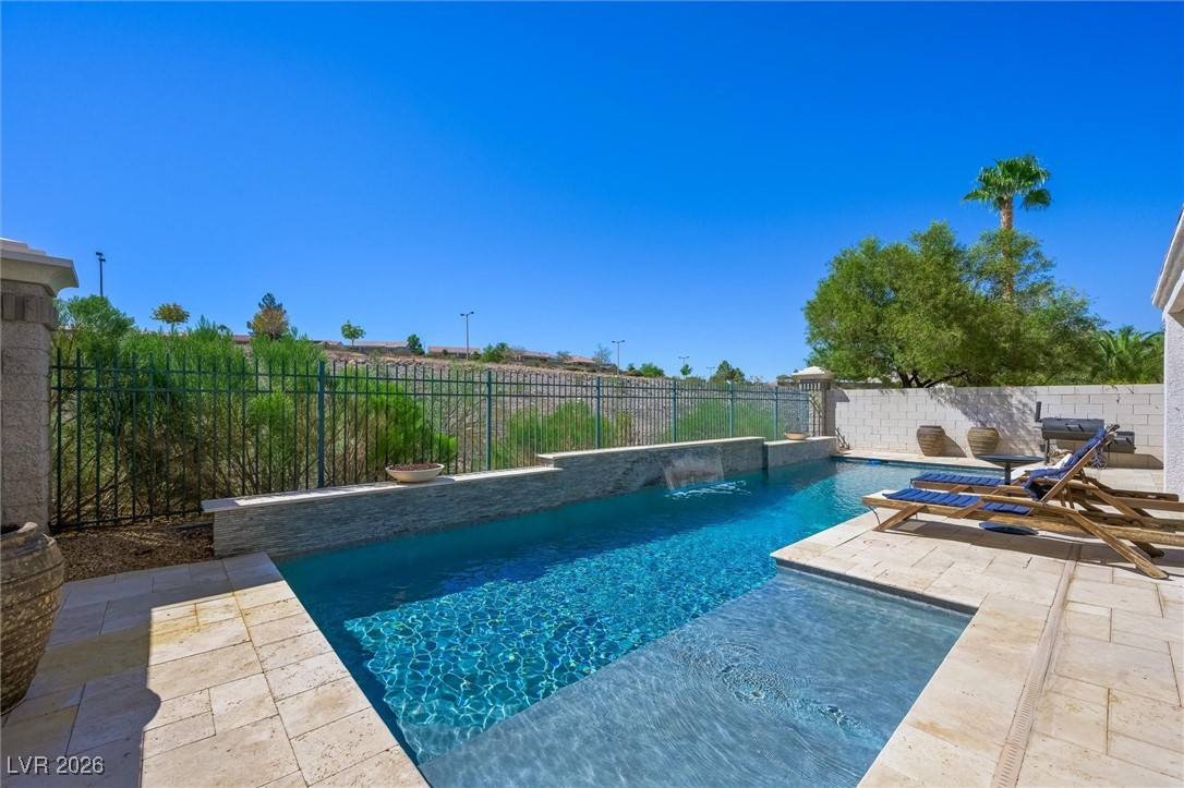1673 Ravanusa Drive Henderson, NV 89052 - Photo 43 of 66 View of pool featuring a patio and a fenced backyard