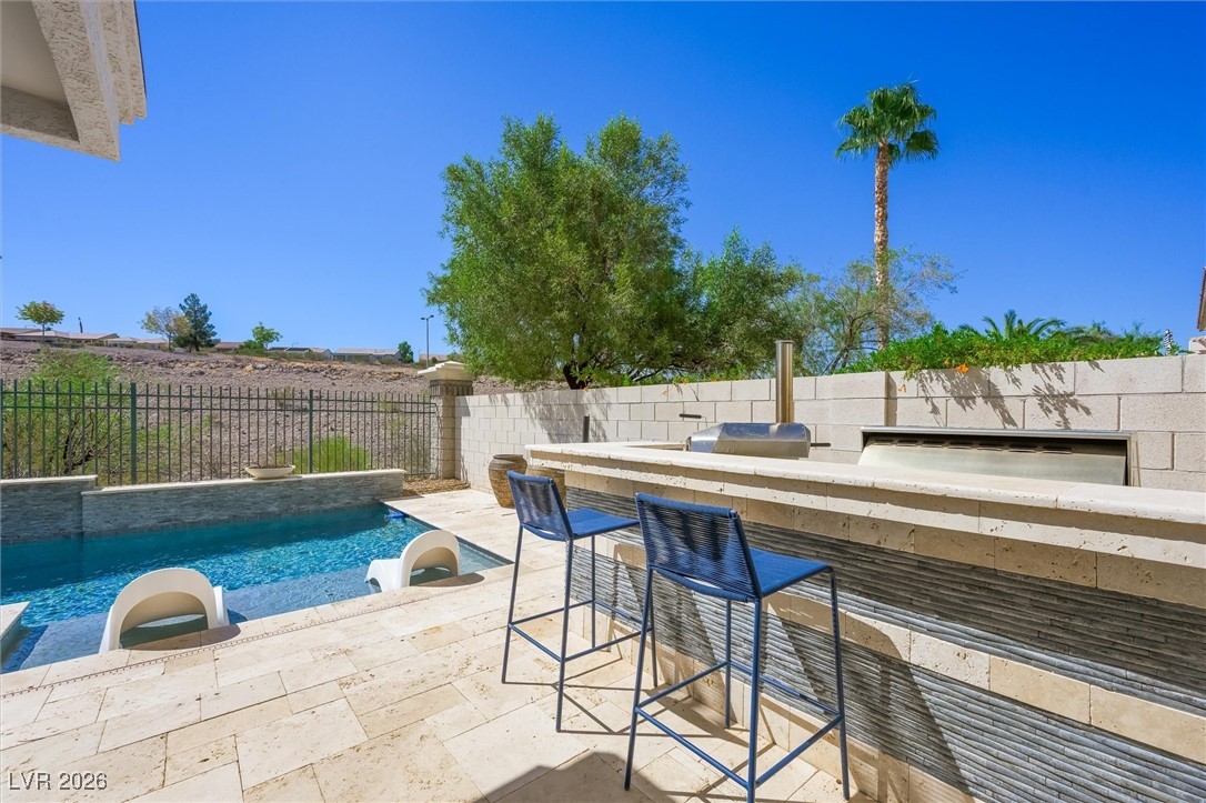 1673 Ravanusa Drive Henderson, NV 89052 - Photo 45 of 66 View of pool with a bar and a patio area