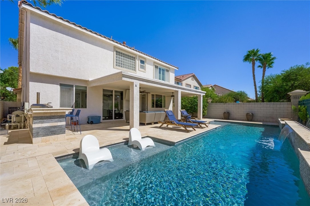 1673 Ravanusa Drive Henderson, NV 89052 - Photo 47 of 66 Rear view of property featuring a patio area, a fenced backyard, stucco siding, and a hot tub