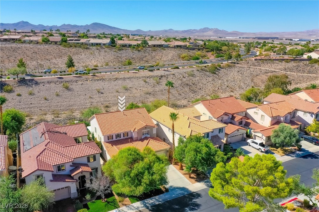 1673 Ravanusa Drive Henderson, NV 89052 - Photo 55 of 66 Aerial view of residential area with a mountain backdrop
