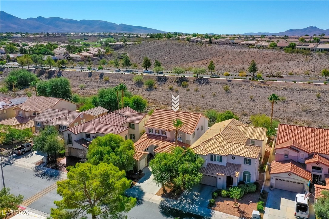 1673 Ravanusa Drive Henderson, NV 89052 - Photo 57 of 66 Aerial view of residential area with a mountain backdrop