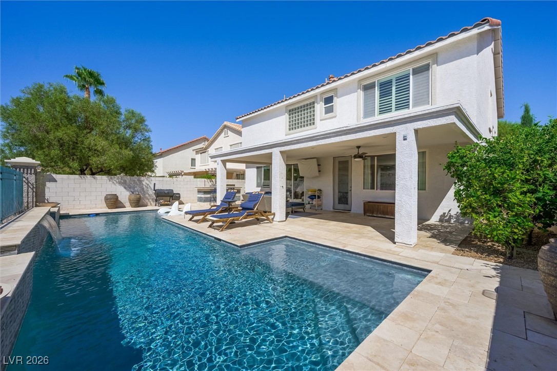 1673 Ravanusa Drive Henderson, NV 89052 - Photo 59 of 66 Back of property featuring a patio area, a fenced backyard, stucco siding, and ceiling fan