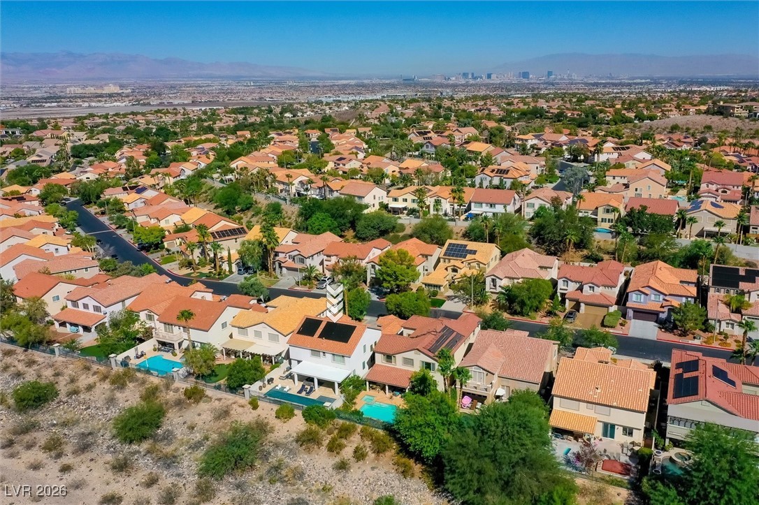 1673 Ravanusa Drive Henderson, NV 89052 - Photo 62 of 66 Aerial view of residential area with a mountainous background