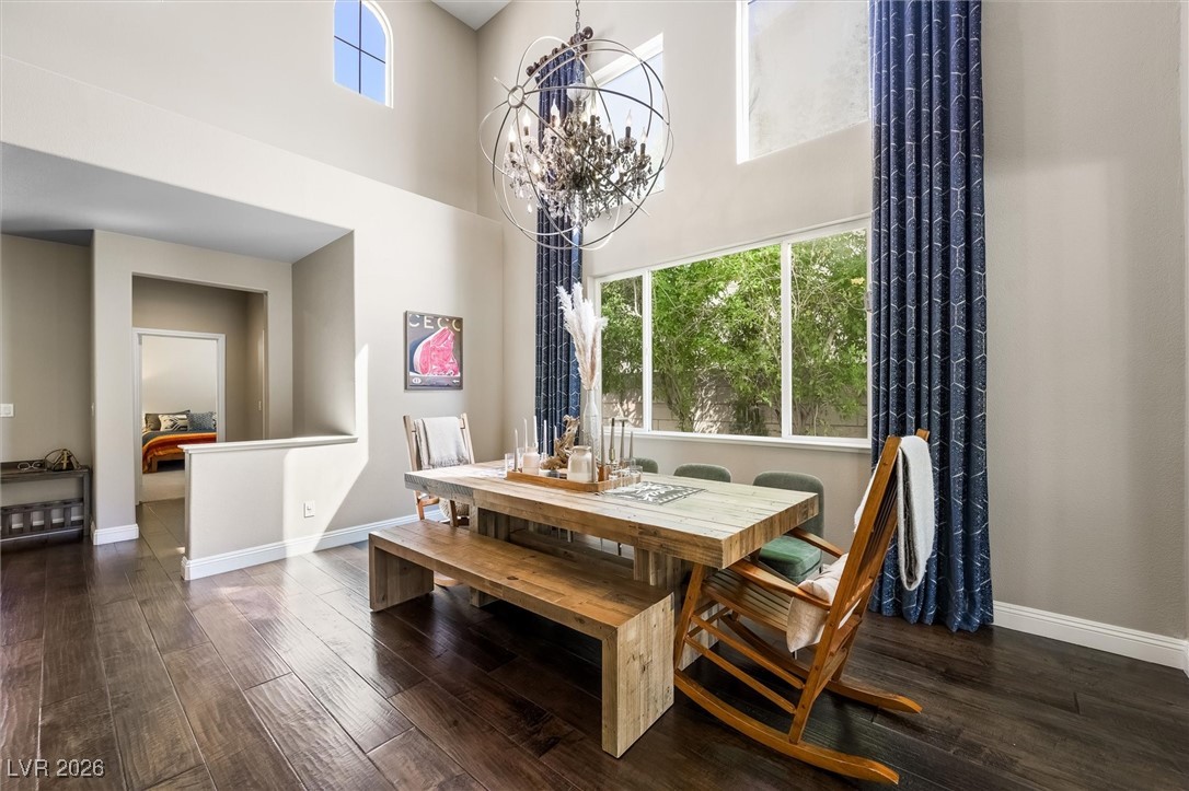 1673 Ravanusa Drive Henderson, NV 89052 - Photo 7 of 66 Custom curtain tie the space together nicely, coordinating perfectly with the custom wall covering in the living area.