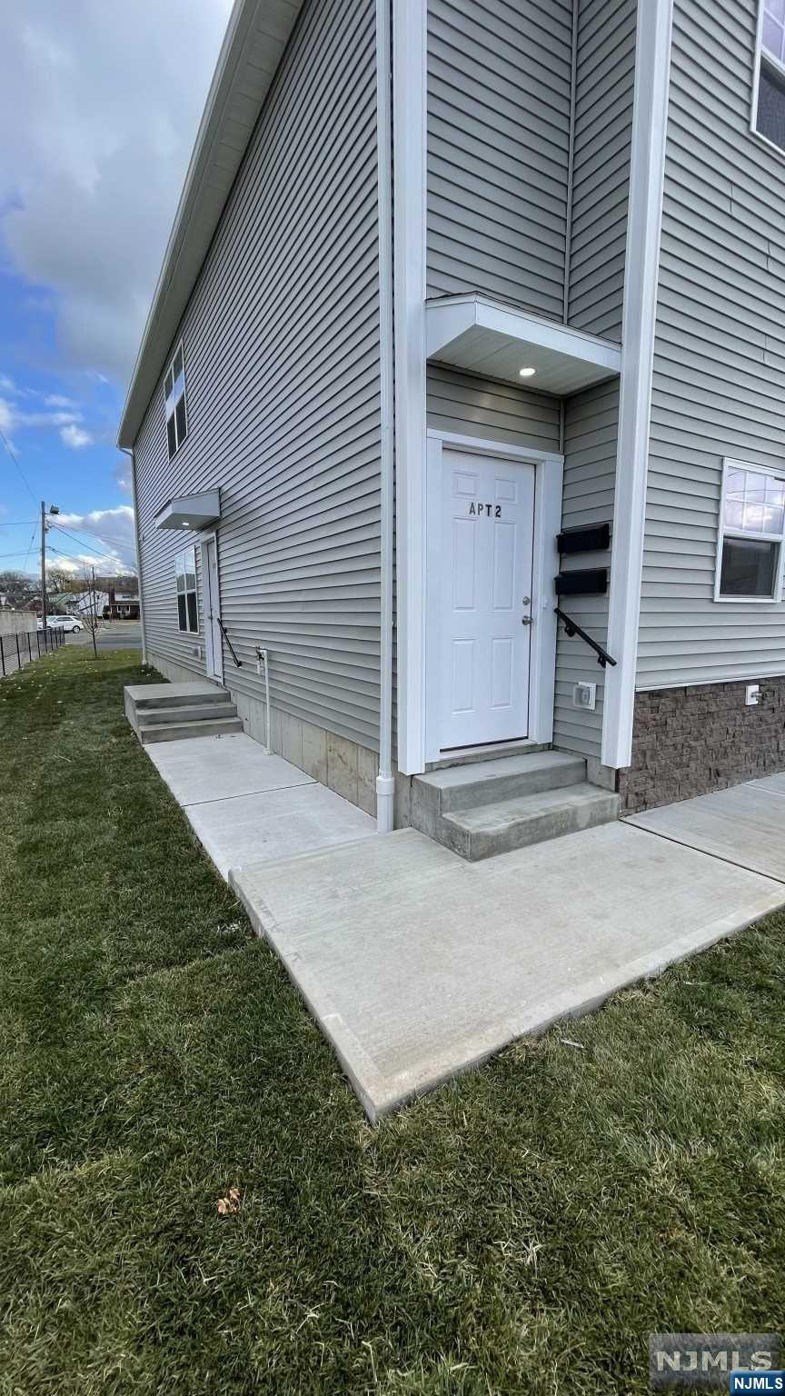 a view of a house with a yard and garage