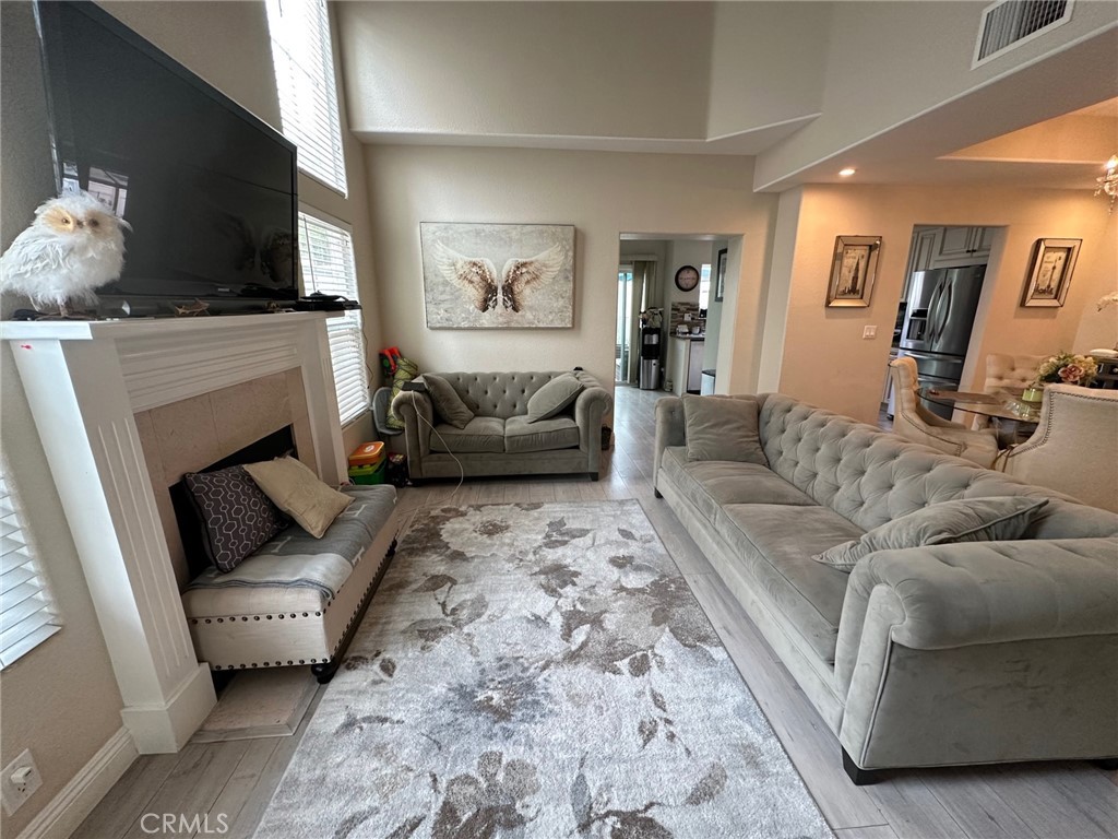 19017 Gault Street, Unit 106 Reseda, CA 91335 - Photo 2 of 6 a living room with furniture and a fireplace