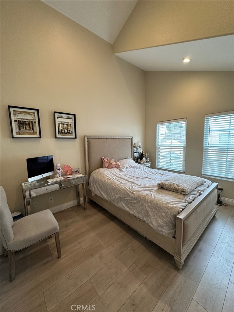 19017 Gault Street, Unit 106 Reseda, CA 91335 - Photo 4 of 6 a bedroom with a bed and a couch