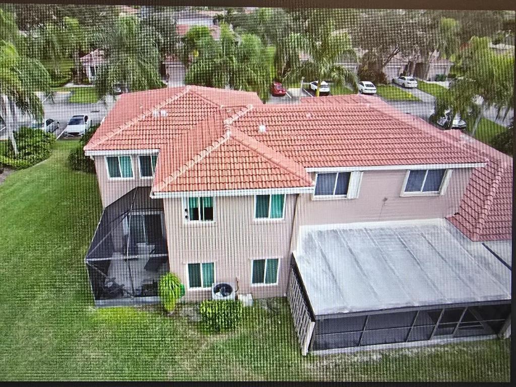 1741 Southwest 109th Terrace Davie, FL 33324 - Photo 9 of 10 a aerial view of a house with a yard