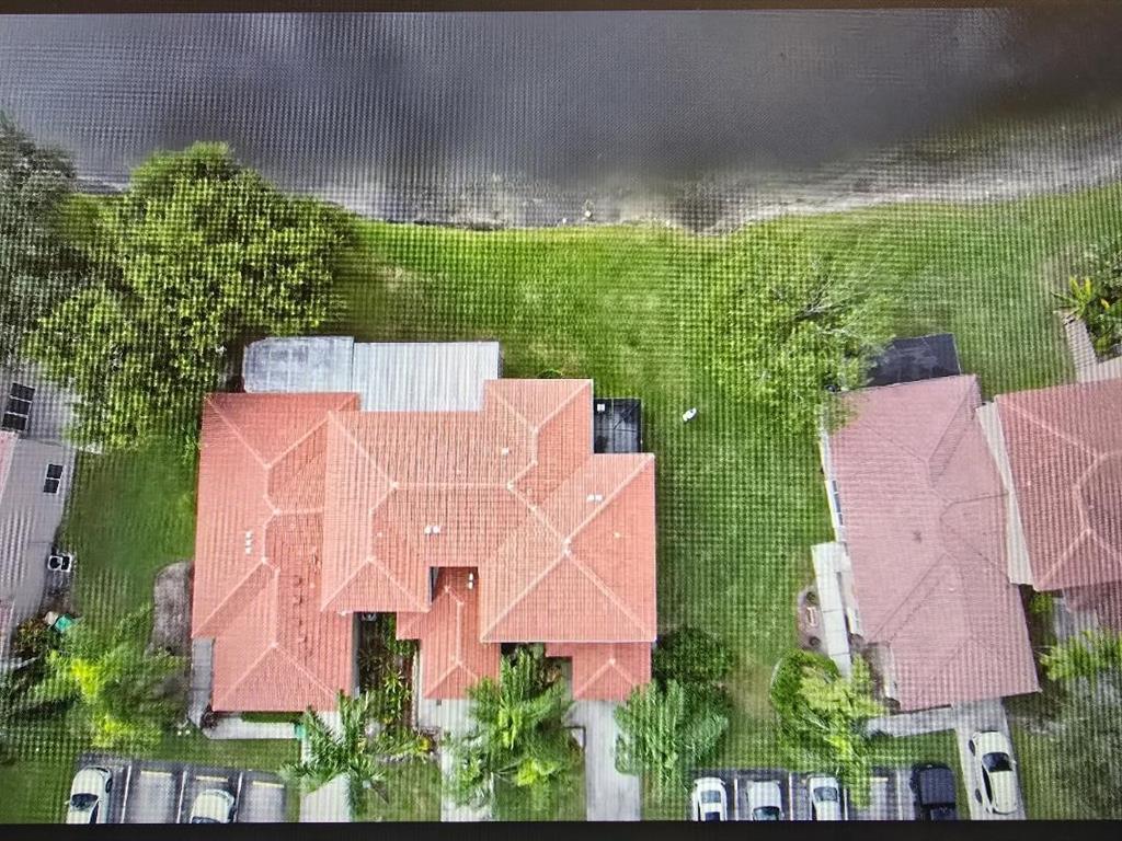 1741 Southwest 109th Terrace Davie, FL 33324 - Photo 10 of 10 an aerial view of a house with a yard and outdoor seating