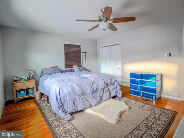 a bedroom with a bed and dresser