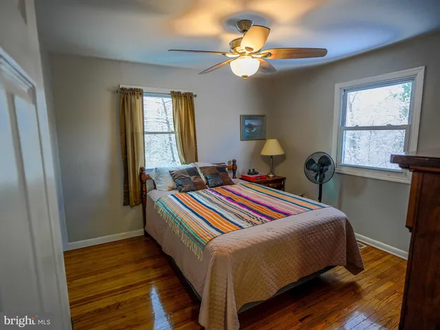 a bedroom with bed and window