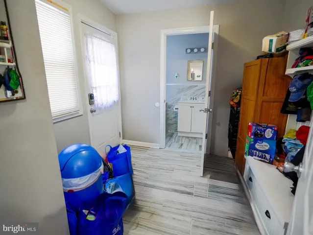 a bathroom with a sink toilet and mirror