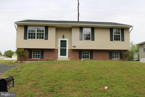 a front view of a house with yard