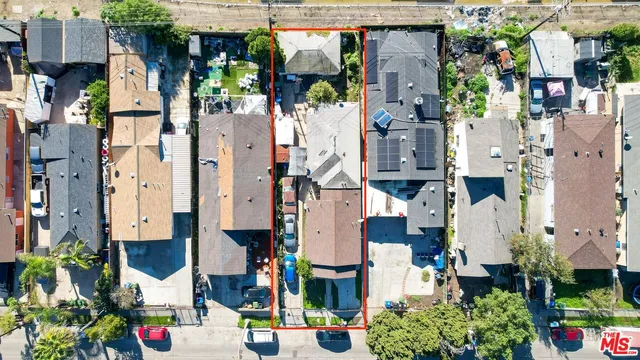 a aerial view of multi story residential apartment building with yard