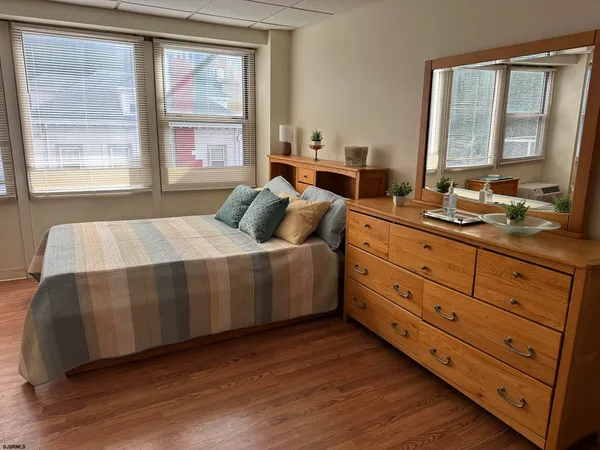 a bedroom with a bed and a desk