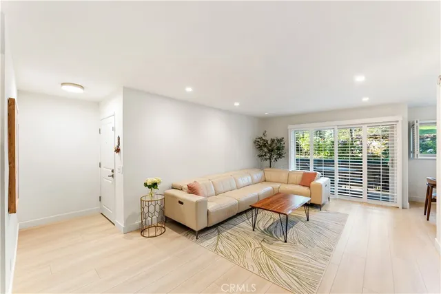 a living room with furniture and windows