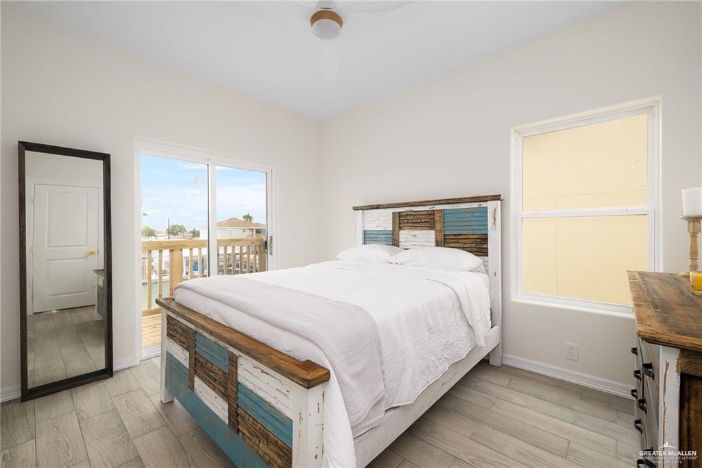 1009 Bass Avenue, Unit 1 Port Isabel, TX 78578 - Photo 12 of 19 a bedroom with a bed and a window