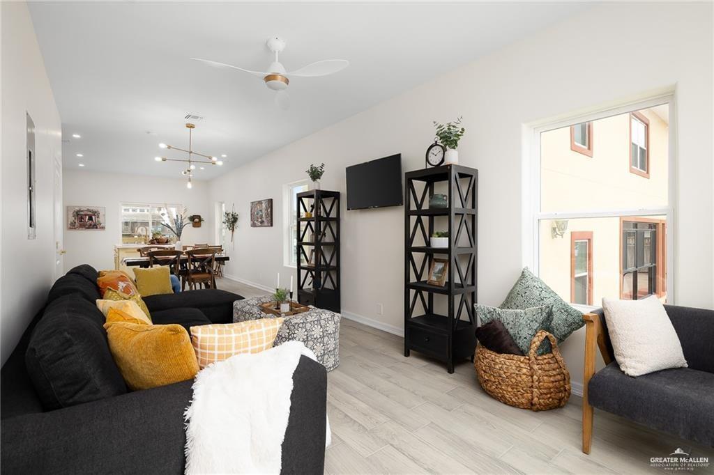 1009 Bass Avenue, Unit 1 Port Isabel, TX 78578 - Photo 4 of 19 a living room with furniture and wooden floor