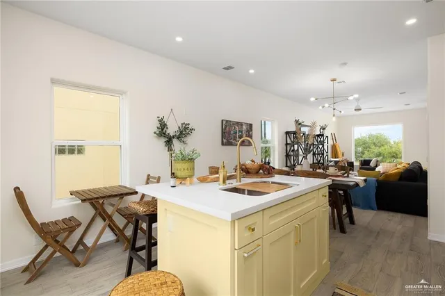 a kitchen that has a table and chairs in it
