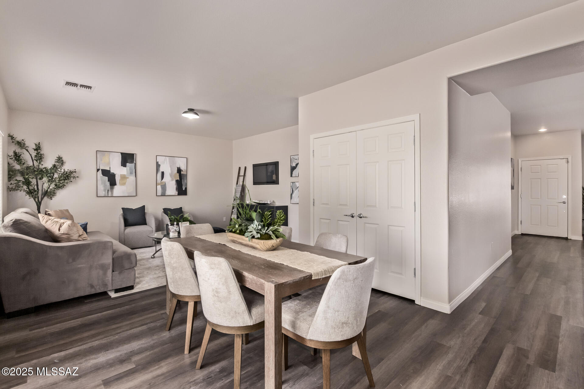20950 East Frontier Road Red Rock, AZ 85145 - Photo 14 of 44 a view of a dining room with furniture and wooden floor