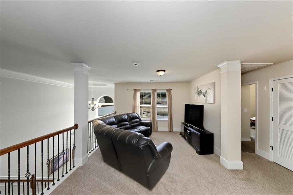 4058 Rosebay Way Southwest Conyers, GA 30094 - Photo 21 of 55 a living room with furniture and a flat screen tv